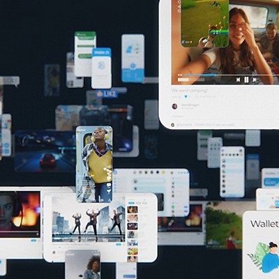 A group of diverse individuals is displayed on a screen, engaged in conversation or collaboration.